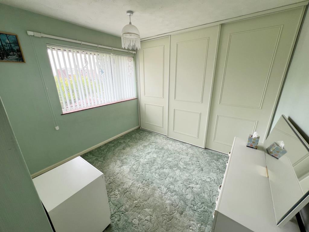 Lot: 116 - END-TERRACE HOUSE WITH DEVELOPMENT POTENTIAL - Bedroom with fitted wardrobes and window to rear aspect
